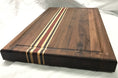 Walnut Cutting Board made with exotics. Strips of solid Wenge wood, Maple & African Padauk